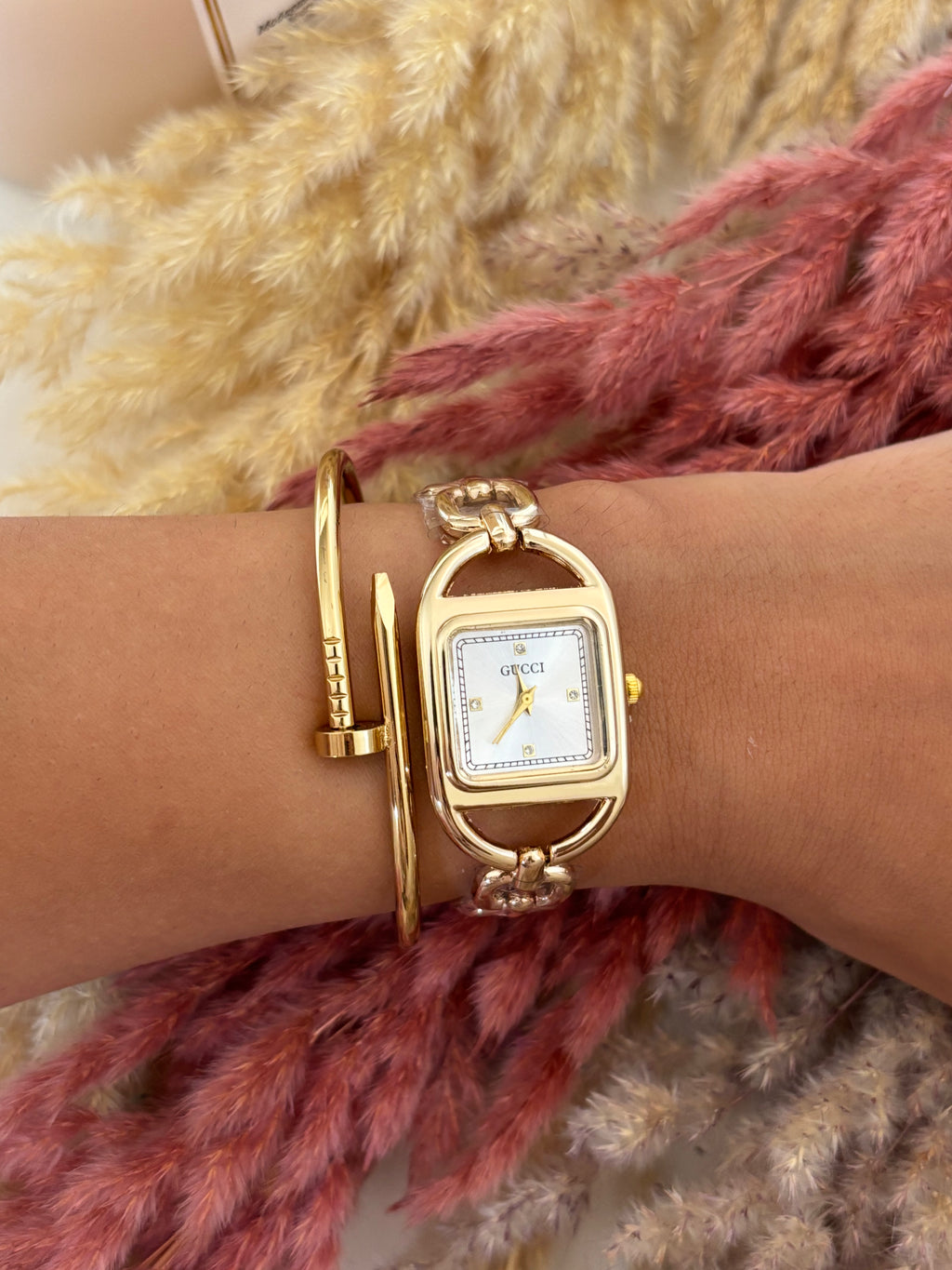 Montre Gucci chaîne dorée