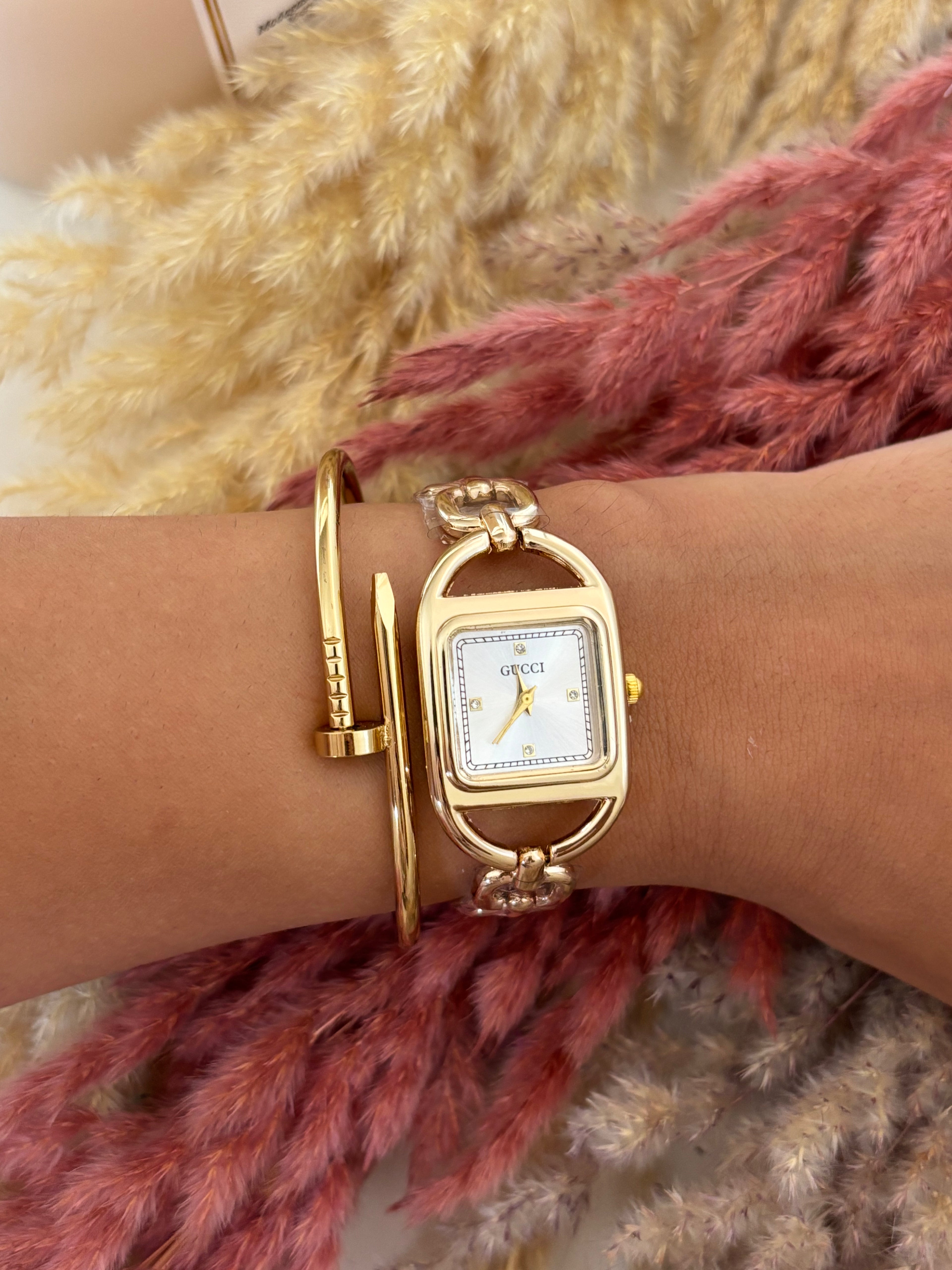 Montre Gucci chaîne dorée